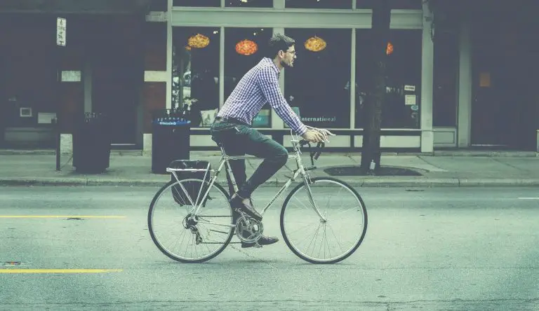 Man Cycling Across Town