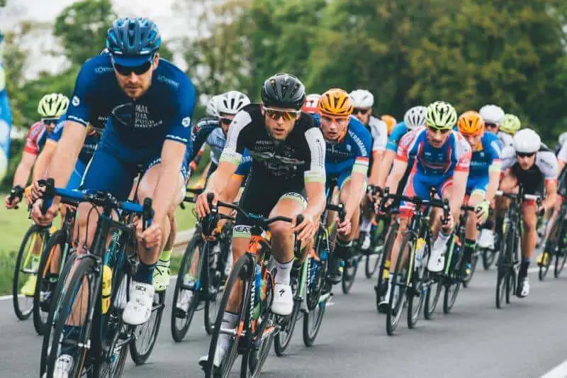 Group of cyclists on asphalt road