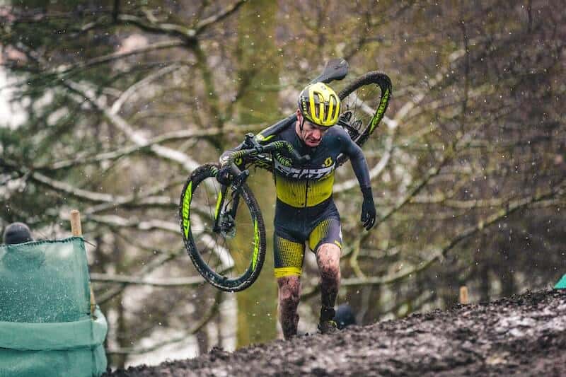 Cyclocross Rider Running Up A Hill