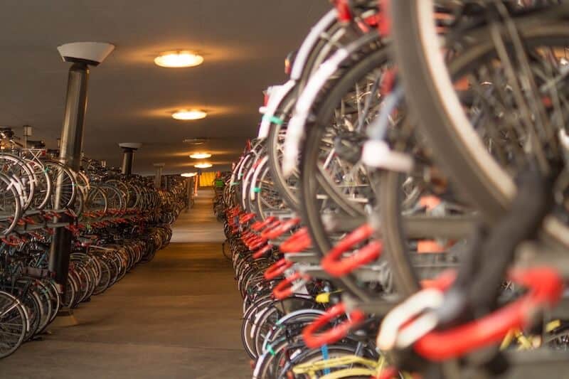 Lots of bikes hung up in a bike garage