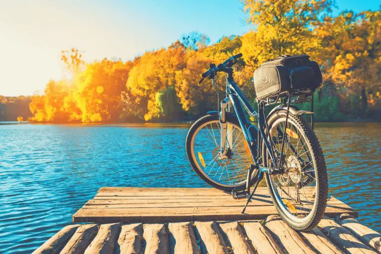 Bike on the river with a bike trunk bag on the back