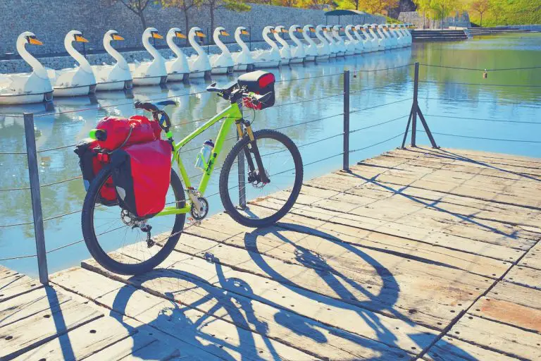 MTB Bicycle touring bike in a park with convertible pannier backpack