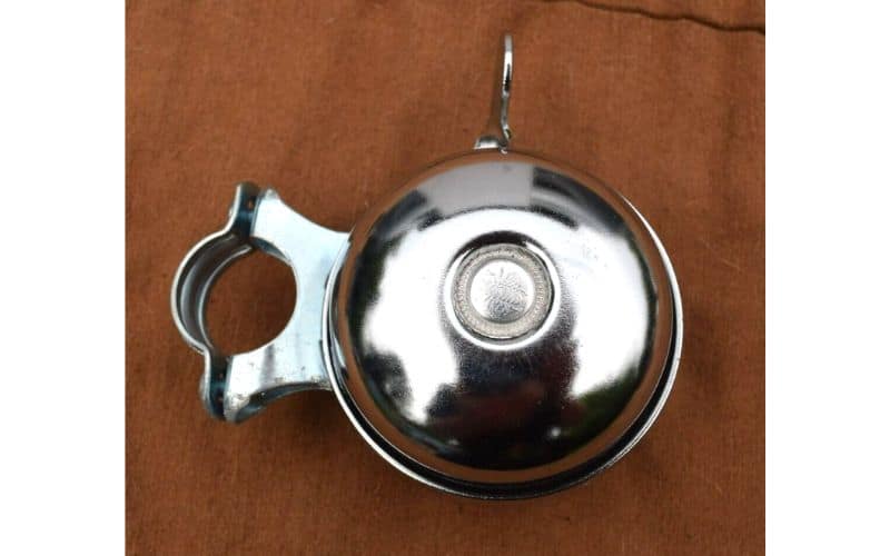 Silver bike bell on wooden table