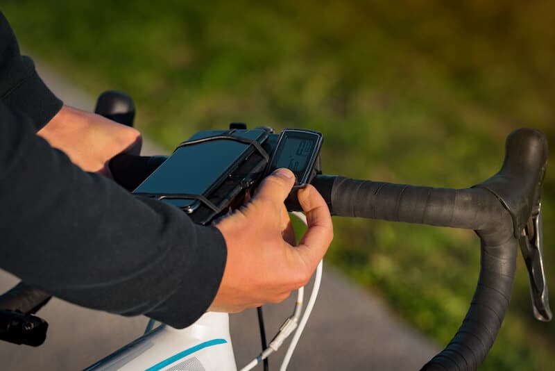 Man using bicycle speedometer