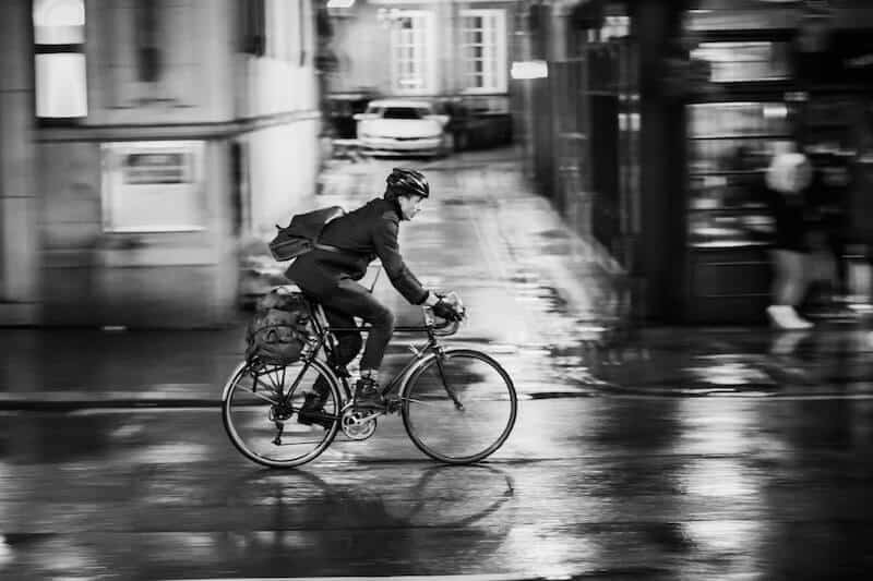 Commuter On A Road Bike In The Rain