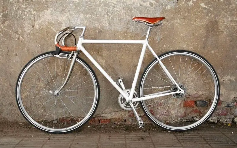 White fixie bike with leather drop handles