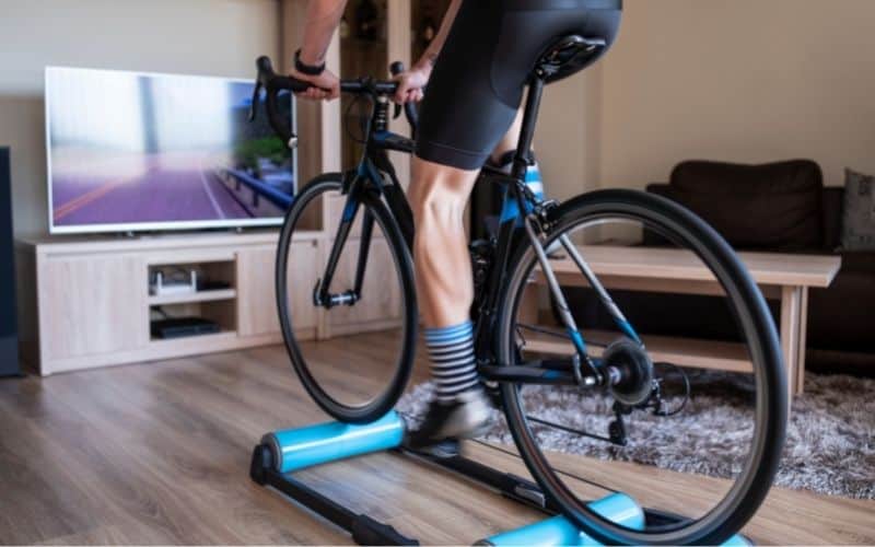 Indoor cyclist on a bike roller trainer