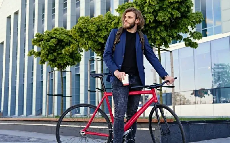 Guy with a red single speed bike drinking coffee