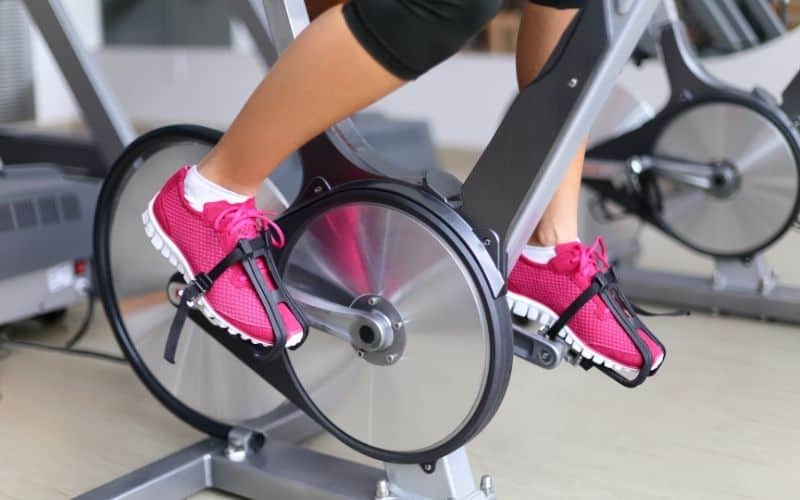 Wearing pink shoes on a spinning bike