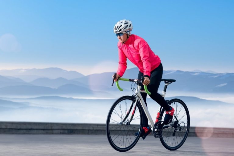 Woman cycling during winter