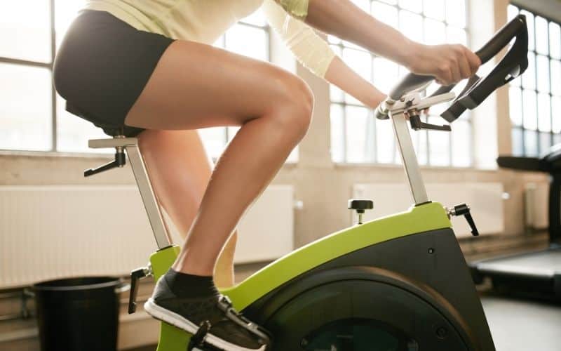 Woman indoor cycling training