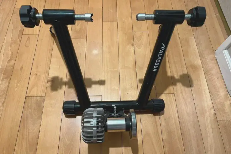 Alpcour Fluid Bike Trainer on a wooden floor