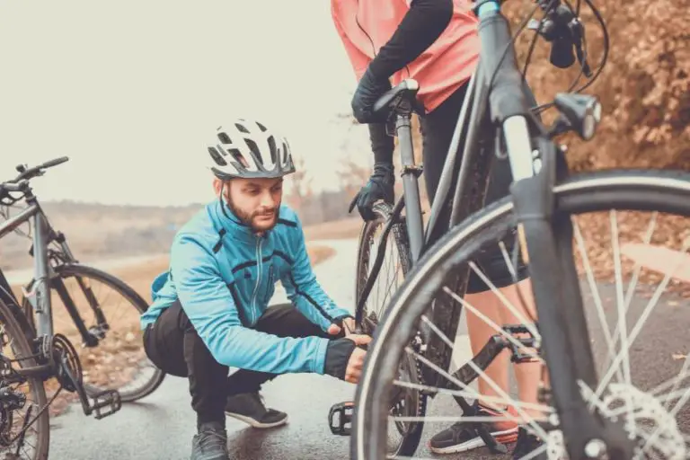 Man inspecting a bike chain