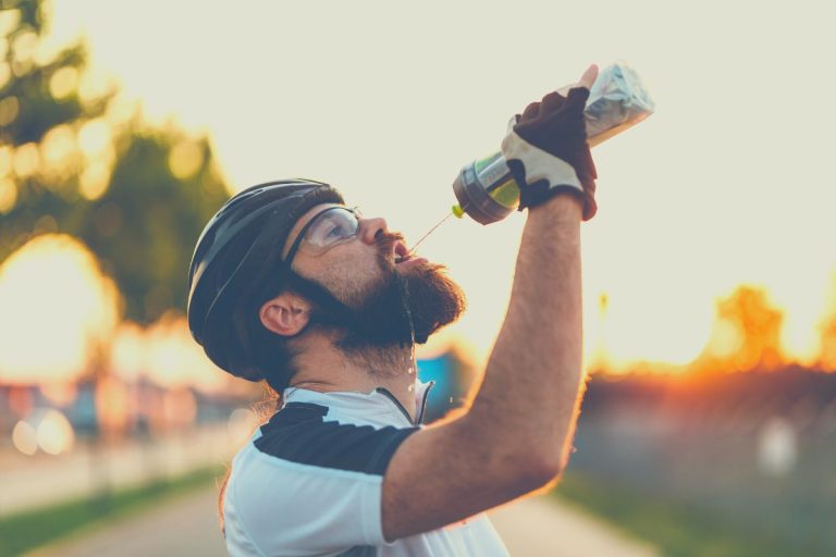 Cyclist drinking from water bottle