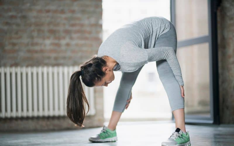 Woman stretching hamstrings