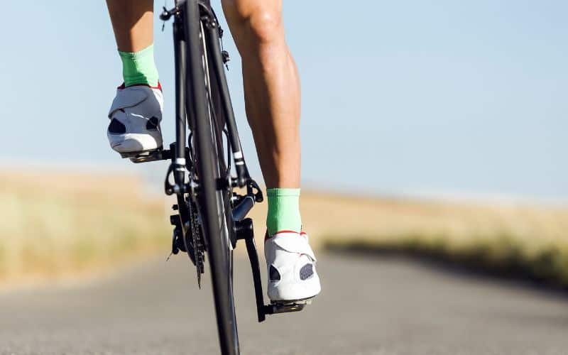 Foot of a young man cycling