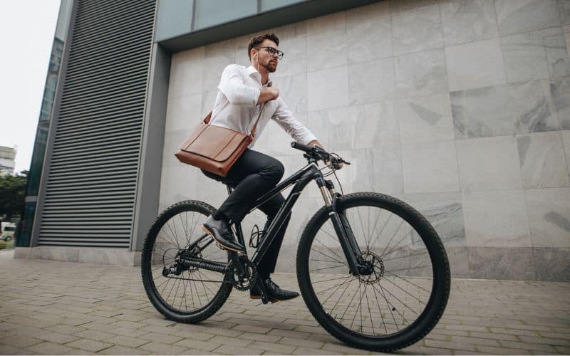 Man cycling to work on with a shirt
