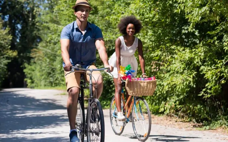 Young couple riding bikes