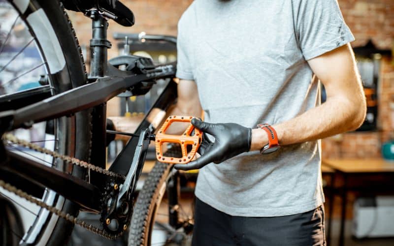 Installing orange bike pedal