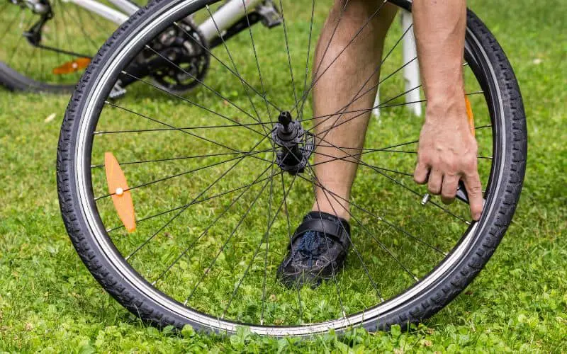 Man changing bike tire