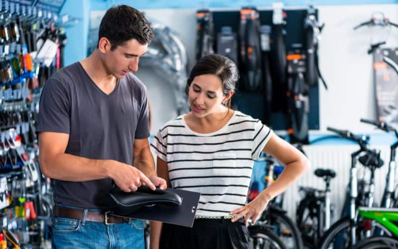 Couple buying a new bike seat