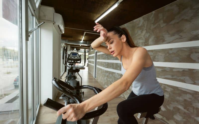 Woman exercising on indoor bike