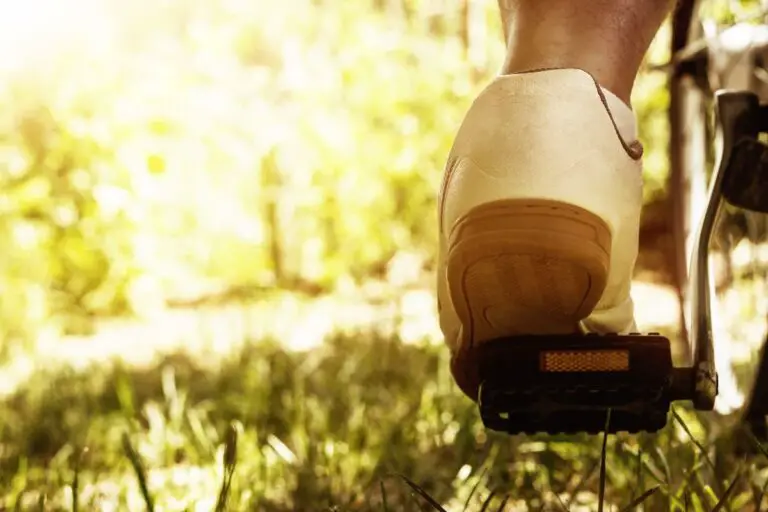 Foot on bike pedal close up