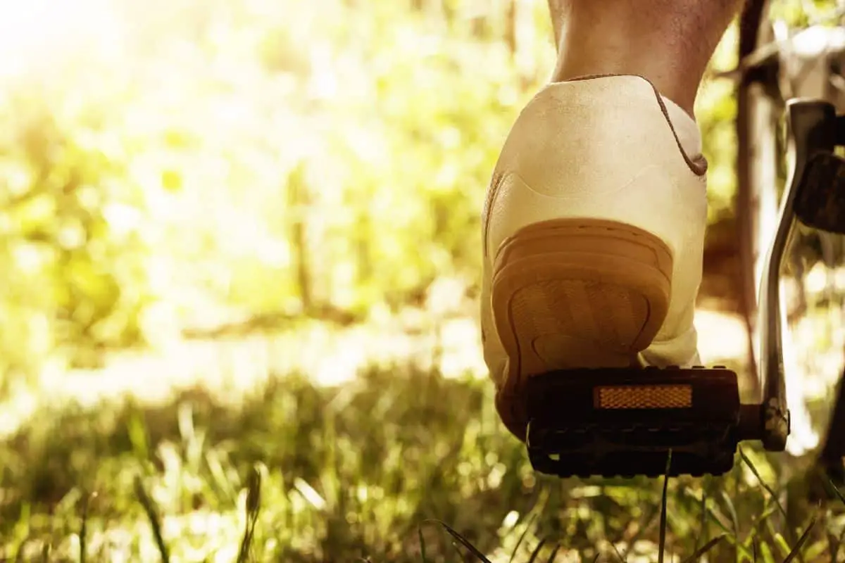 Foot on bike pedal close up