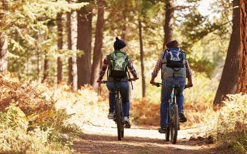 Couple that is trail riding
