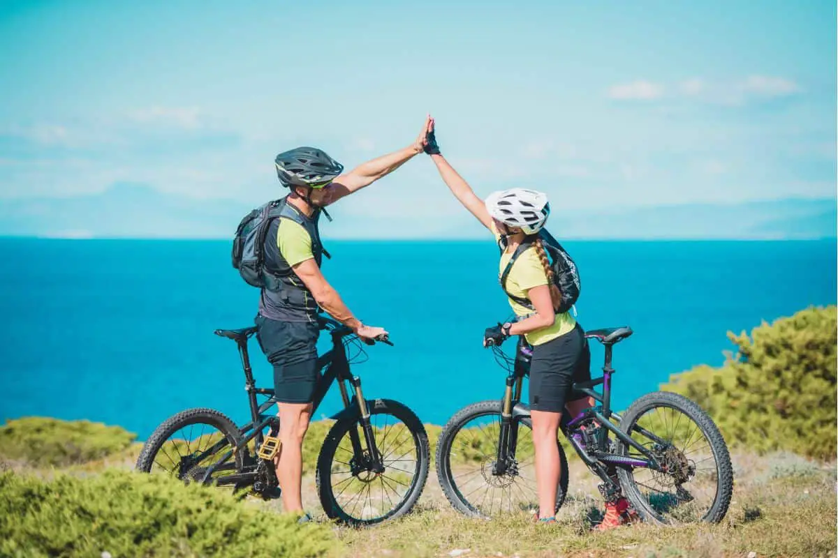 A couple that is mountain biking