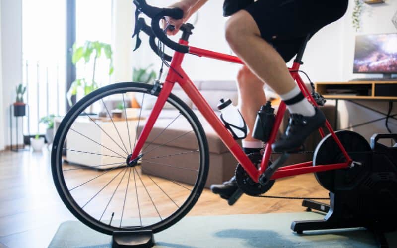 Bike trainer on yoga mat